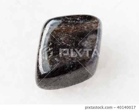 tumbled anthophyllite gemstone on white 40140017