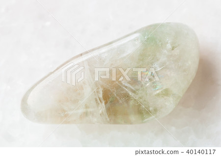 tumbled Prasiolite gemstone on white 40140117