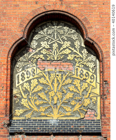 Ancient bass relief showing a big tree on brick wall from 1899 40140619