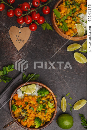 Vegan Sweet Potato Chickpea curry in wooden bowl Vegan Sweet Potato Chickpea curry in wooden bowl 40141126