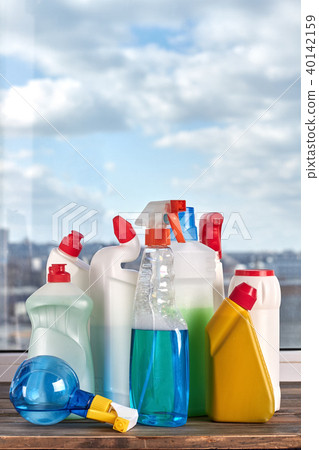 Assorted bottles with liquid for cleaning. Assorted bottles with liquid for cleaning. 40142159