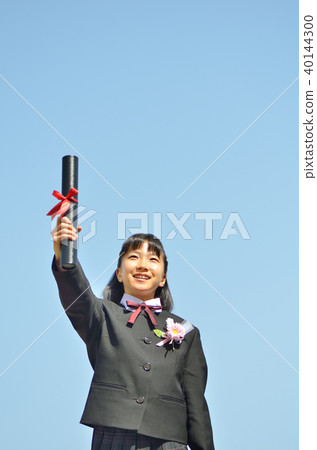 Sixth grader girl (graduation, blue sky) 40144300
