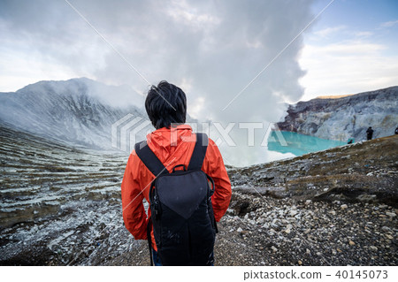 Young traveler looking crater blue lake 40145073