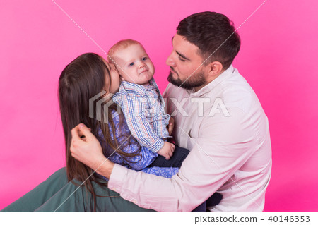 Father with children having fun on pink background Father with children having fun on pink background 40146353