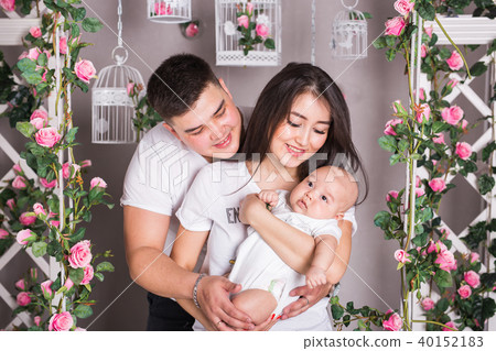 Indoor portrait of asian mixed race family with infant baby 40152183