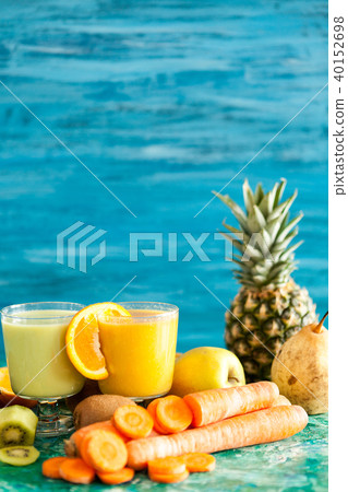 Detox juices next to fruits and vegetables Detox juices next to fruits and vegetables 40152698