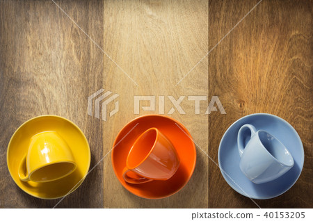 empty cup and saucer at wooden background empty cup and saucer at wooden background 40153205