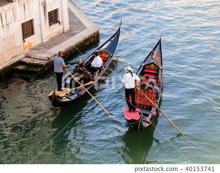 Two Gondolier rides gondola on the Grand Channel Two Gondolier rides gondola on the Grand Channel 40153741