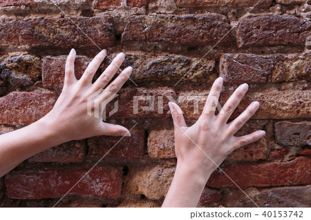 hand on an old brick wall hand on an old brick wall 40153742