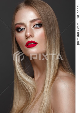 Beautiful blond girl with a perfectly smooth hair, classic make-up and red lips. Beauty face Beautiful blond girl with a perfectly smooth hair, classic make-up and red lips. Beauty face 40155330