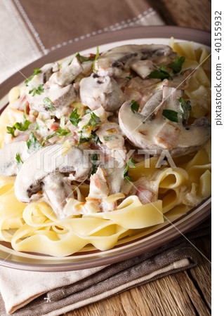 Pasta fettuccini with Boscaiola sauce close-up 40155932