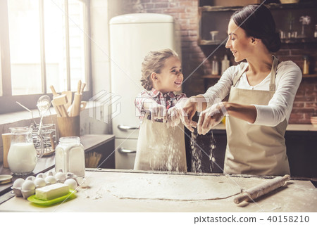 Mom and daughter baking Mom and daughter baking 40158210