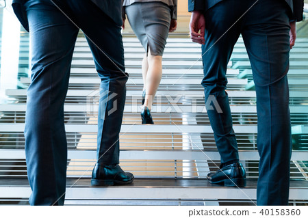 A businessman going up the stairs A businessman going up the stairs 40158360