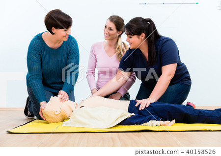 Group of women in first aid course Group of women in first aid course 40158526