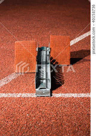 Starrting blocks at cindertrack of athletics stadium 40158736