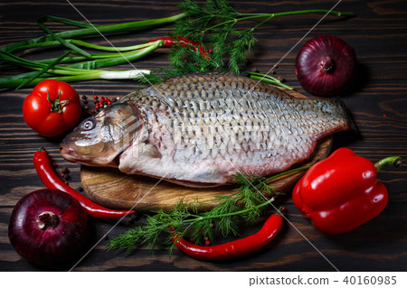 Carp fish with fresh vegetables Carp fish with fresh vegetables 40160985