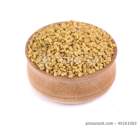 Fenugreek seeds in wooden bowl, isolated on white background 40161083