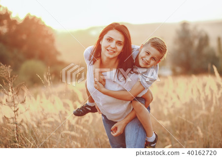 mom and son hugging 40162720