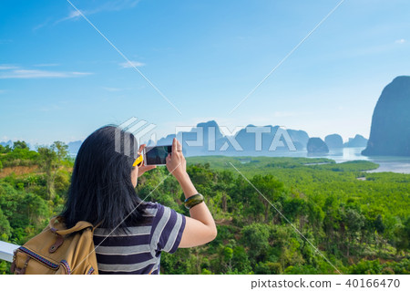 Young traveler woman backpacker use mobile Young traveler woman backpacker use mobile 40166470
