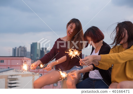Happy group of asia friend enjoy and play sparkler Happy group of asia friend enjoy and play sparkler 40166471