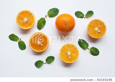 Fresh orange on white, Healthy vitamin drink. Fresh orange on white, Healthy vitamin drink. 40169296