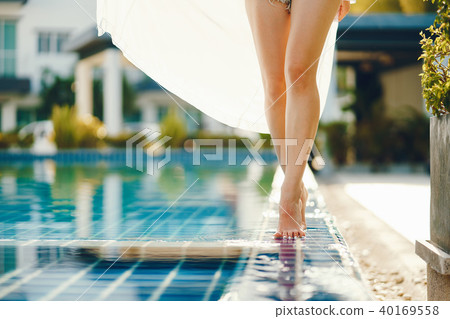 brunette girl relaxing at the pool brunette girl relaxing at the pool 40169558