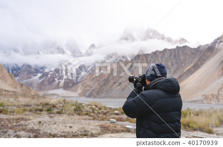 Photographer taking photograph of mountains 40170939
