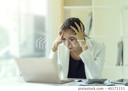 Businesswoman frustrated and stressed on his work Businesswoman frustrated and stressed on his work 40171151