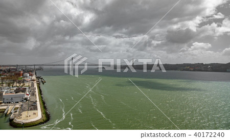 Wide top view 25 de Abril Bridge in Lisbon over Tagus river 40172240