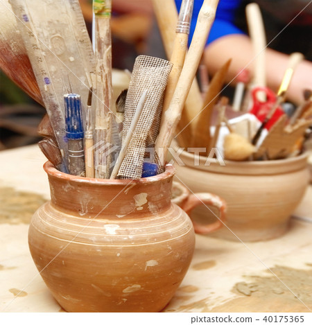 Handmade old clay pots with pencils 40175365