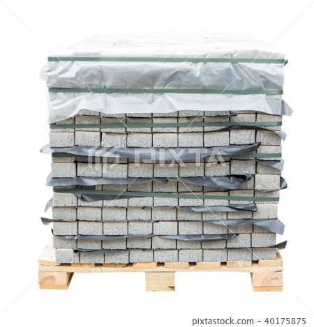 Stack of gray pavement slab on wooden base. Concrete stone paving flag. Isolated on white Stack of gray pavement slab on wooden base. Concrete stone paving flag. Isolated on white 40175875