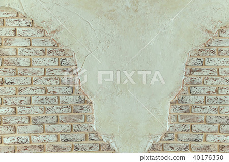 Vintage brick wall with shabby white stucco. 40176350