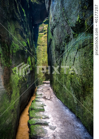 Walkway through rocky gorge. Walkway through rocky gorge. 40177207