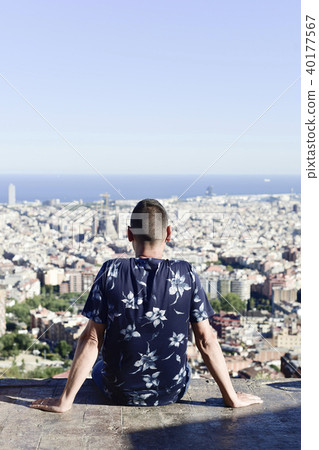 young man with Barcelona, Spain, below him 40177567