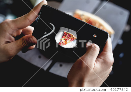 Closeup of hands male in the restaurant taking picture food with smart phone. Closeup of hands male in the restaurant taking picture food with smart phone. 40177842