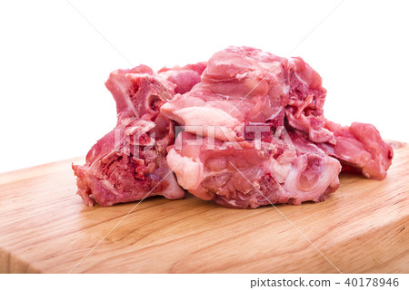 Heap of raw pork bones on wooden background 40178946