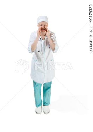 Beautiful young woman in white coat posing at studio. Full length studio shot isolated on white. 40179326