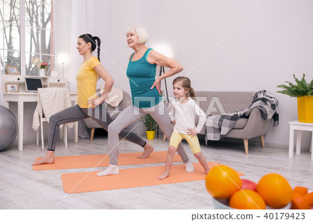 Happy sporty family exercising together 40179423