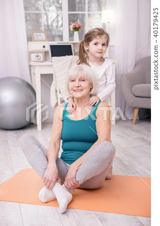 Charming girl hugging her grandmother 40179425