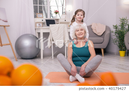 Adorable girl hugging her grandmother 40179427