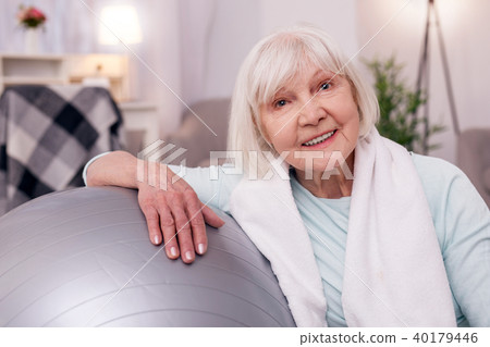 Close up of elderly woman resting after yoga practice Close up of elderly woman resting after yoga practice 40179446