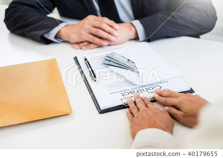 Corrupted businessman, or politician bribe in the form of hundre Corrupted businessman, or politician bribe in the form of hundre 40179655