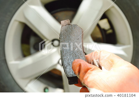 hand in glove holding invalid brake lining  40181104