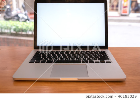 Computer notebook and flower with a coffee shop 40183029