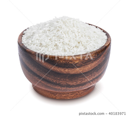 Basmati rice groats in wooden bowl isolated on white background Basmati rice groats in wooden bowl isolated on white background 40183971