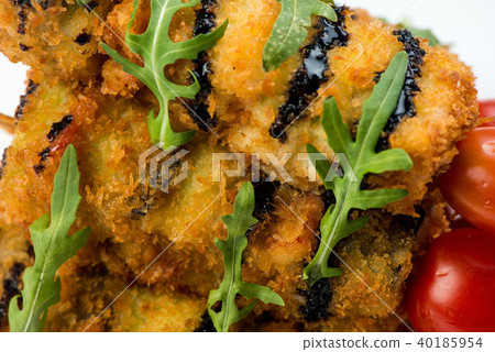 vegetables on skewer fried in batter decorated with tomatoes zucchini, eggplant, zucchini. white vegetables on skewer fried in batter decorated with tomatoes zucchini, eggplant, zucchini. white 40185954