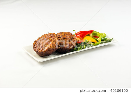 Fried cutlets and vegetable salad white plate on white background Fried cutlets and vegetable salad white plate on white background 40186100