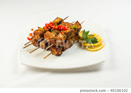 Fried fish in lemon and mint sauce on skewers . square sliced BBQ lunch Fried fish in lemon and mint sauce on skewers . square sliced BBQ lunch 40186102