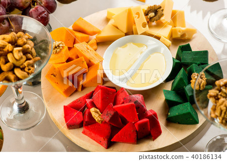 Pieces of cheese of different varieties with honey Pieces of cheese of different varieties with honey 40186134