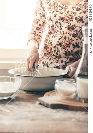 Woman Mixing Batter Woman Mixing Batter 40186486